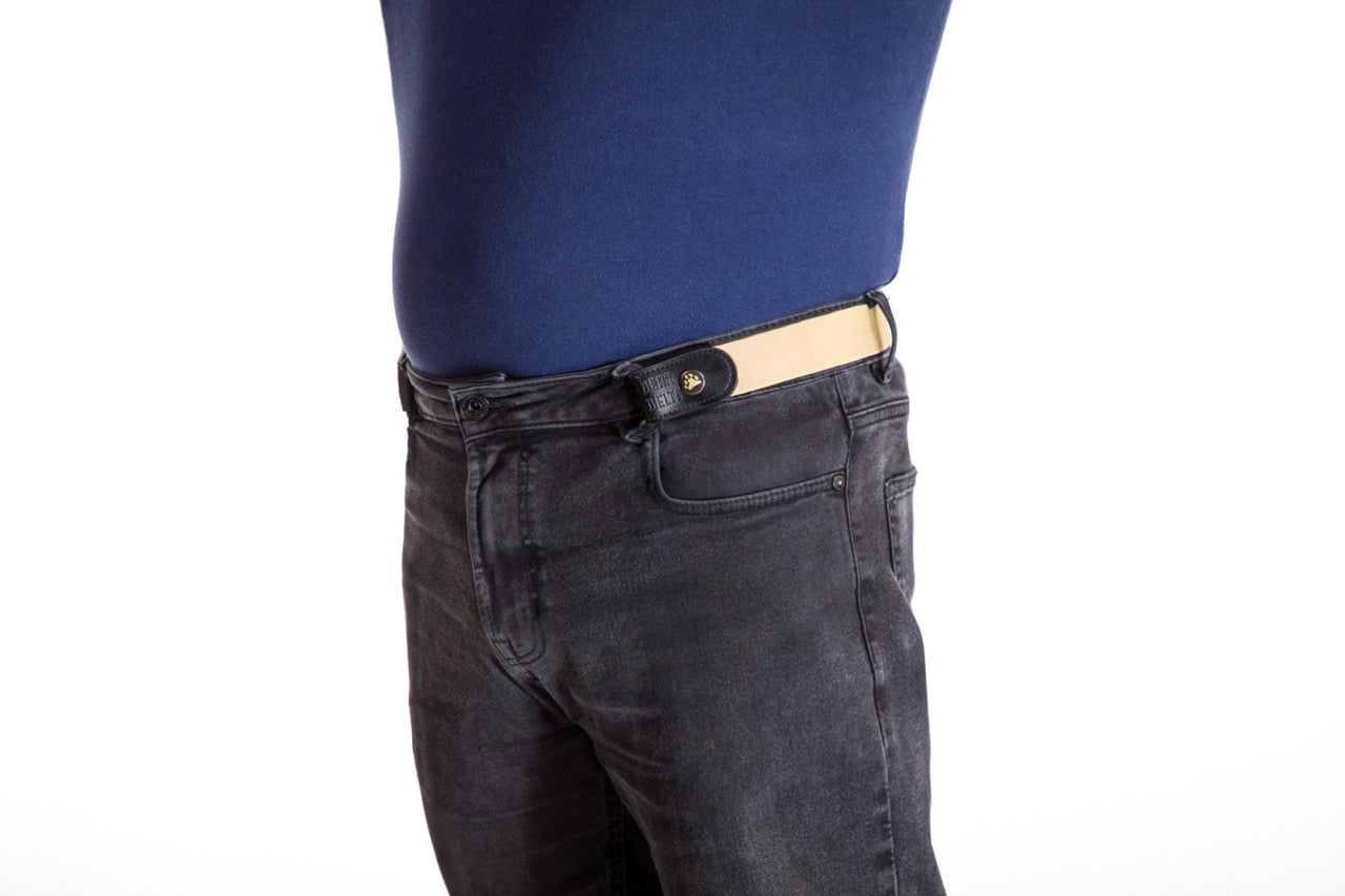 Person wearing black jeans with a tan Bear Belts belt on a white background.